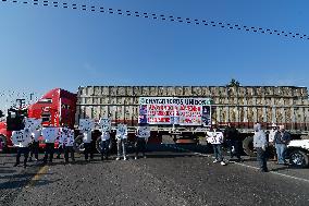 Scrap Metal Dealers Blockade And Demonstrate On State Highway