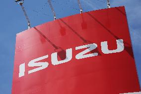 Logo and signage for Isuzu dealership.