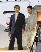Japan emperor, empress return home