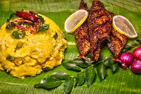 Kerala Style Fried Fish With Tapioca Served On Banana Leaf