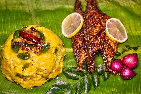 Kerala Style Fried Fish With Tapioca Served On Banana Leaf