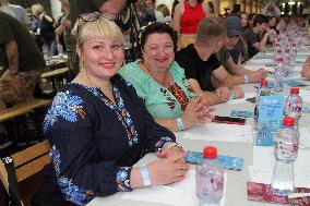 Dnipro residents write dictation in subway on Constitution Day