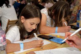 Dnipro residents write dictation in subway on Constitution Day