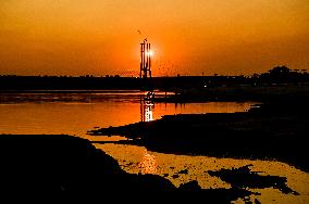 Sunset fishing on shallow Dnipro river