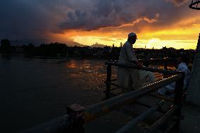 People Enjoying Sunset View In Kashmir