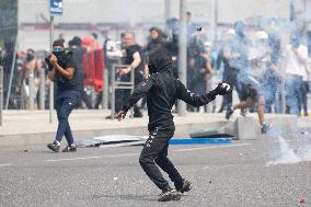 Protesters clash with police after the commemoration march for Nahel - Nanterre