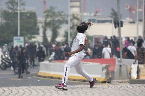 Protesters clash with police after the commemoration march for Nahel - Nanterre