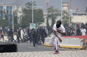 Protesters clash with police after the commemoration march for Nahel - Nanterre