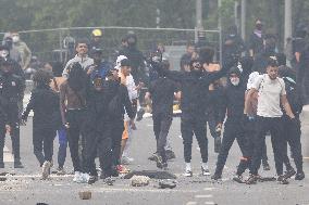 Protesters clash with police after the commemoration march for Nahel - Nanterre