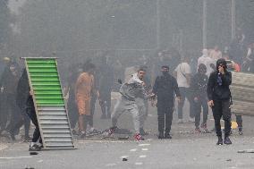 Protesters clash with police after the commemoration march for Nahel - Nanterre
