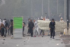 Protesters clash with police after the commemoration march for Nahel - Nanterre