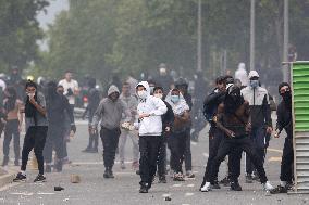 Protesters clash with police after the commemoration march for Nahel - Nanterre