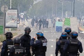 Protesters clash with police after the commemoration march for Nahel - Nanterre