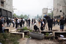 Protesters clash with police after the commemoration march for Nahel - Nanterre