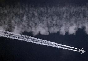 Aircraft Ejecting Contrails