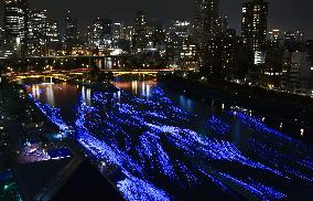 Osaka river lit up blue