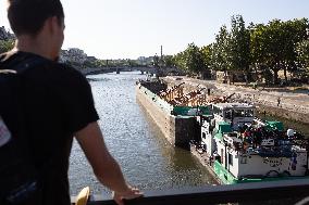 First truss delivered to Notre Dame by a barge cruises along the Seine - Paris