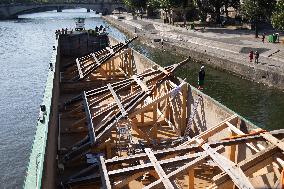 First truss delivered to Notre Dame by a barge cruises along the Seine - Paris