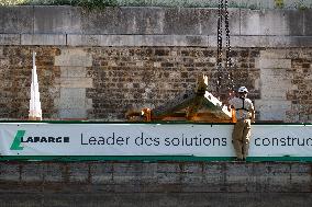 First truss delivered to Notre Dame by a barge cruises along the Seine - Paris