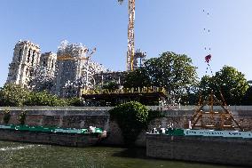 First truss delivered to Notre Dame by a barge cruises along the Seine - Paris