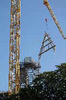 First truss delivered to Notre Dame by a barge cruises along the Seine - Paris