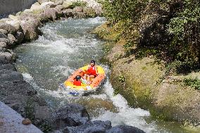 Visitors Experience Rafting During High Temperature