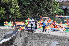 Visitors Experience Rafting During High Temperature