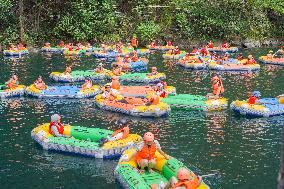 Visitors Experience Rafting During High Temperature