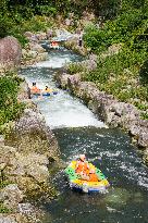 Visitors Experience Rafting During High Temperature