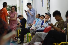 Citizens Cool Off in An Air-raid Shelter in Nanjing