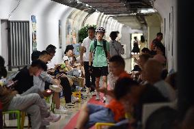 Citizens Cool Off in An Air-raid Shelter in Nanjing