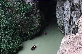 Tourists Cross The Hidden River By Boat To Escape The Heat in Chongqing