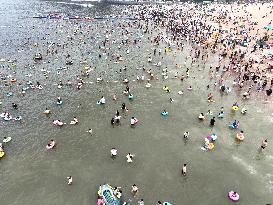 Tourists Cool Off in the Dasha Bay Beach in Lianyungang