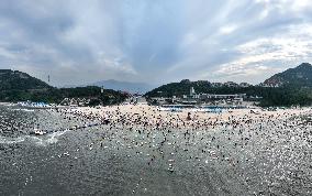 Tourists Cool Off in the Dasha Bay Beach in Lianyungang
