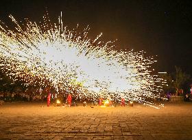 Artists Perform The Intangible Cultural Heritage Beat Iron Flower in Yuncheng