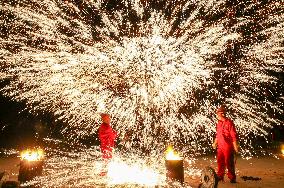 Artists Perform The Intangible Cultural Heritage Beat Iron Flower in Yuncheng