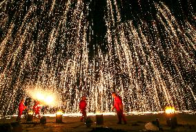 Artists Perform The Intangible Cultural Heritage Beat Iron Flower in Yuncheng