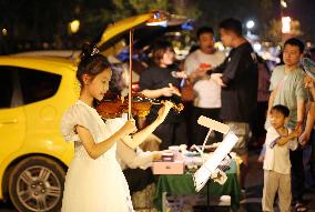 Citizens shop At A Car Trunk Market in Linyi, China