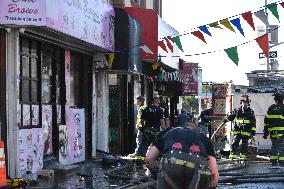 4 Alarm Fire Damages Several Stores In The Bronx; 7 Firefighters And 1 Civilian Injured