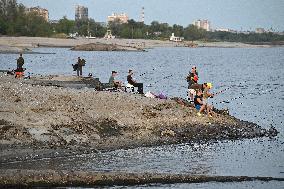 Relaxing at shallow bank of Dnipro River