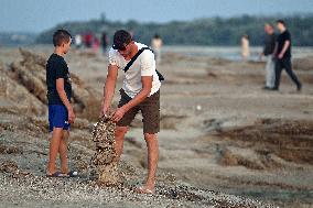 Relaxing at shallow bank of Dnipro River