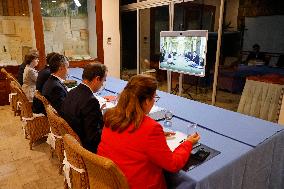 Macron at cabinet meeting via video conference with other ministers in Noumea