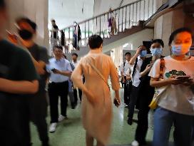 Commuters Ride at Jianguomen Subway Station in Beijing