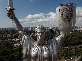 Workers Dismount A Soviet Coat Of Arms From The Shield Of The Motherland Monument In Kyiv