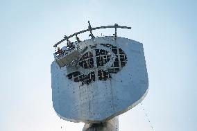 Dismantling The Coat Of Arms Of The USSR From The Statue "Motherland" In Kyiv