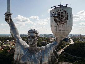 Workers Dismount A Soviet Coat Of Arms From The Shield Of The Motherland Monument In Kyiv