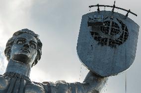 Workers Dismount A Soviet Coat Of Arms From The Shield Of The Motherland Monument In Kyiv