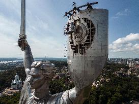 Workers Dismount A Soviet Coat Of Arms From The Shield Of The Motherland Monument In Kyiv