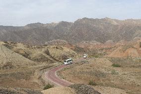 Tourists View The Danxia Landform in Zhangye, China