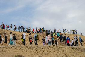 Tourists View The Danxia Landform in Zhangye, China